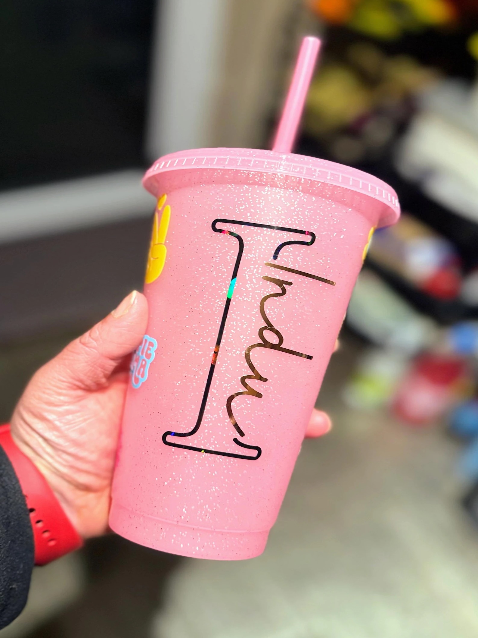 Pink glitter cup with personalised name.
